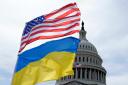 The American and Ukrainian flags wave in the wind outside of the Capitol on Tuesday (Mariam Zuhaib/AP)