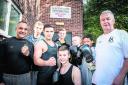 Head coach Tony Gibson, right, with coaches Carl Lawrence, left, and Liam Boggs and young boxers at Blackbird Leys Amateur Boxing Club. Picture: OX62452 Ryan Cowan