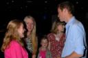 Luke Biggs, centre, and his mother Karen, second right, are pictured with Prince William and other guests from the wildchild charity