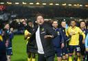 Oxford United head coach Des Buckingham celebrates with the away support in the second leg