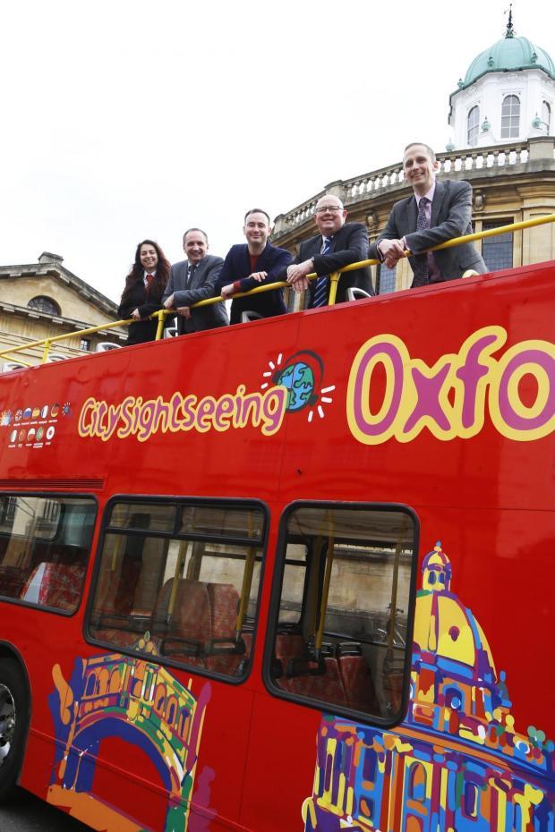 Civic leaders on a City Sightseeing bus in 2020