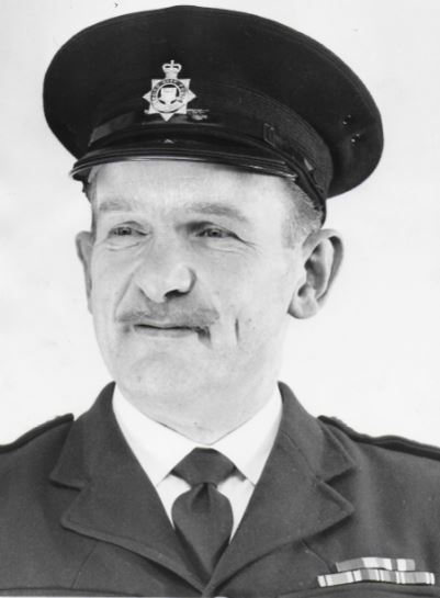 Cliff Dunkley as a police officer 