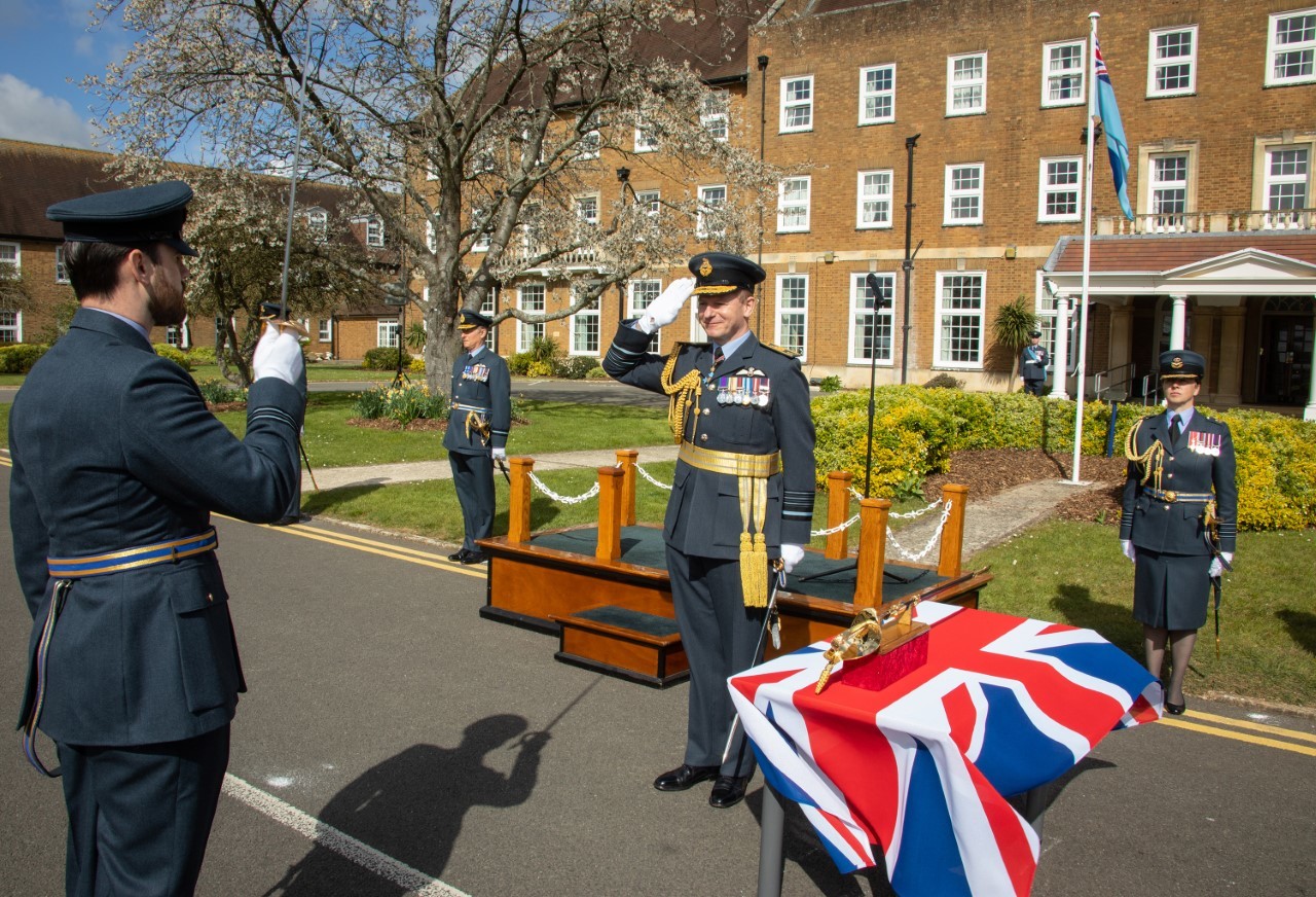 Ben Burton salutes chief of the air staff Mike Wigston, prior to receiving the Firmin Sword of Peace. Picture: MOD Crown