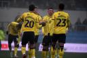 Oxford United players celebrate against Grimsby Town