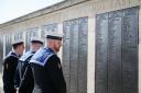 Royal Navy ratings look at the names on one of the panels on the Portsmouth Naval memorial in Southsea (Andrew Matthews/PA)