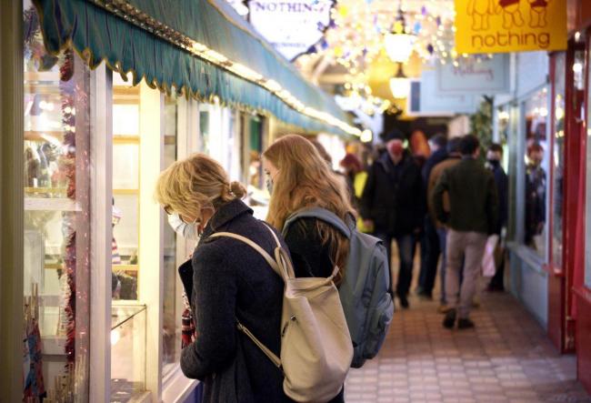 Shoppers look for gifts in the Covered Market