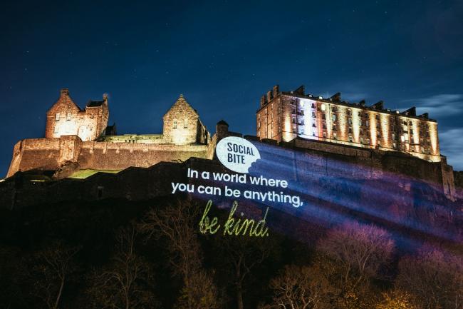 Social Bite's projection on the cliffs below Edinburgh Castle