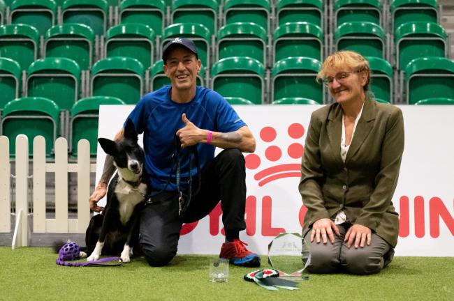 Photo caption: James Mclelland and Nessie, winners of the Starters Cup final – Intermediate, who were presented the award by judge, Hannah Banks. Credit: Yulia Titovets/The Kennel Club 