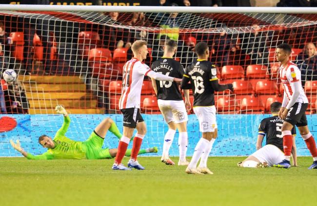 Morgan Whittaker (right) turns away after beating Simon Eastwood for Lincoln City's second goal Picture: Steve Edmunds