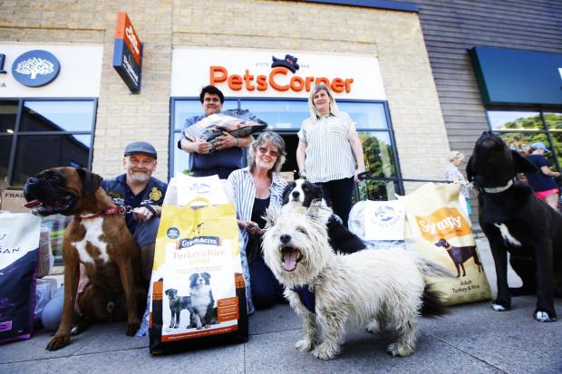 thisisoxfordshire: Bonnie Cowdrey (centre) with donations for the Chipping Norton Pet Food Bank, upon its launch in June 2020. Picture: Ed Nix