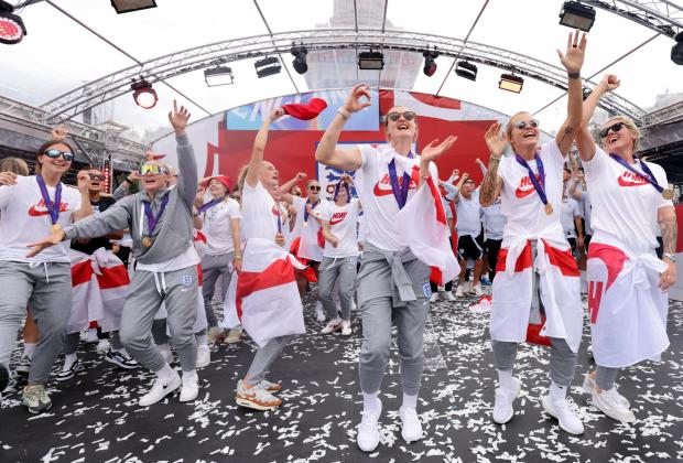 thisisoxfordshire: England players sing Sweet Caroline on stage during a fan celebration to commemorate England's historic UEFA Women's EURO 2022 triumph in Trafalgar Square. Credit: PA
