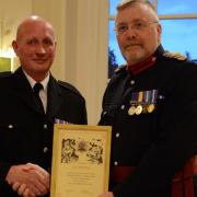Ivor Matthews (left) received a certificate for 40 years of service from Major James Sibbald, deputy lieutenant of Oxfordshire (right)