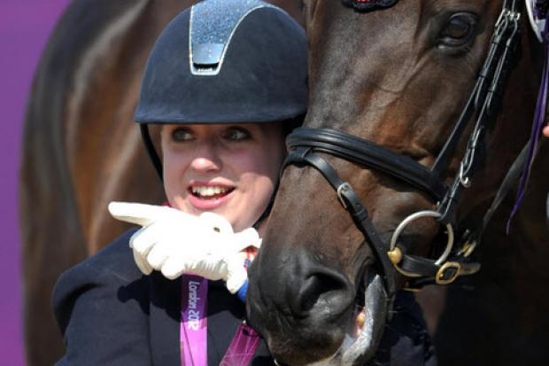 Golden girl Natasha Baker poses with her horse, Cabral